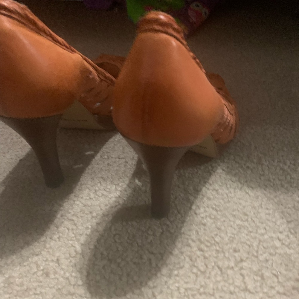 Orange high heeled shoes
